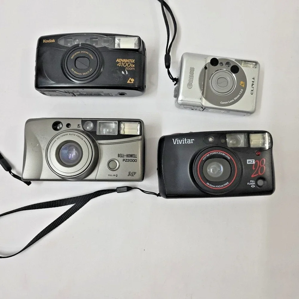 Lot of 4 Film Cameras, Kodak, Canon, Bell Howell, Vivitar Not Film Tested Read